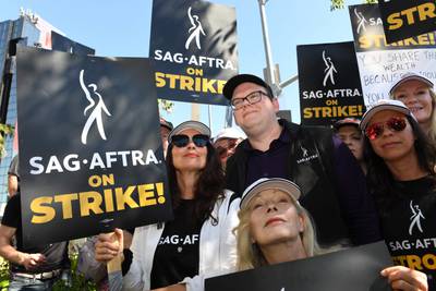 Sag-Aftra president Fran Drescher with national executive director and chief negotiator Duncan Crabtree-Ireland at a picket line outside Netflix in Los Angeles. AFP
