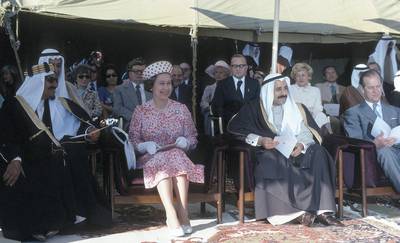 KUWAIT - FEBRUARY13:  Queen Elizabeth ll , Sheikh Abdullah Jabir (Left) and Prince Philip, Duke of Edinburgh watch a dancing display during a tour  of the Gulf States on February 13, 1979 in Kuwait. (Photo by Anwar Hussein/Getty Images)
