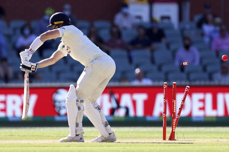 England's Chris Woakes is bowled by Jhye Richardson during the fifth day of the Adelaide Test. AP