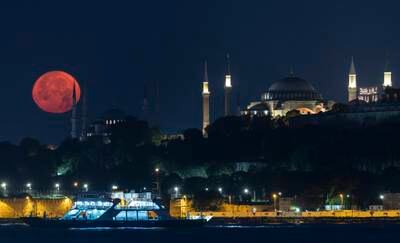 A full moon behind the Blue Mosque and the Hagia Sophia Grand Mosque, in Istanbul, Turkey. EPA