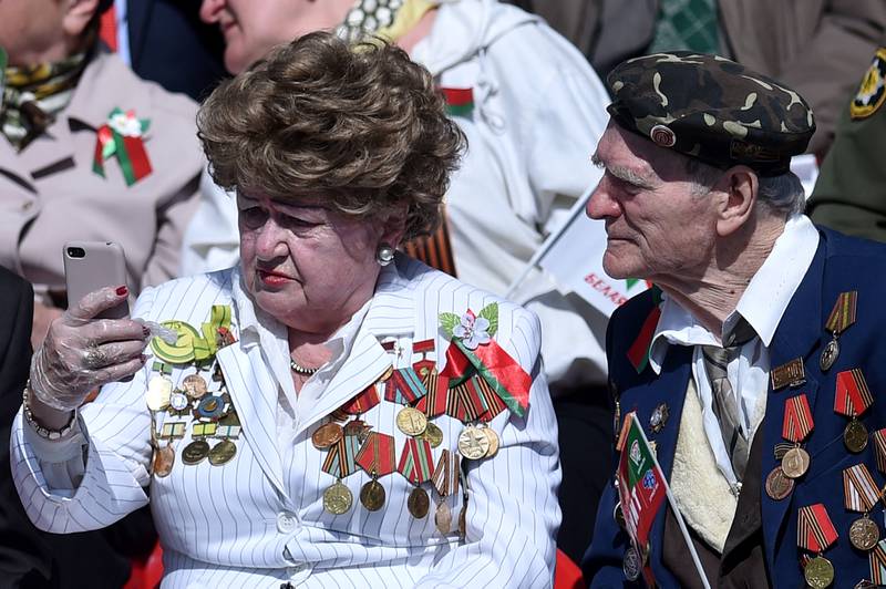 Veterans gather to watch a military parade to mark the 75th anniversary of the Soviet Union's victory over Nazi Germany in Minsk on May 9, 2020. Russia and its former republics are estimated to be home 100,000 surviving veterans because of the very young age at which soldiers were conscripted. AFP