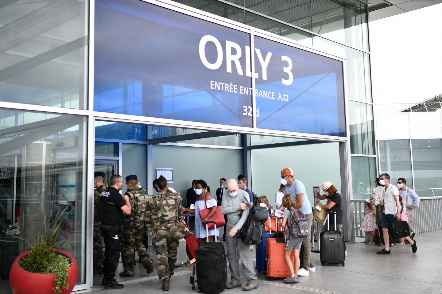 Travellers line up at the Orly Airport, south of Paris, during a major weekend of the French summer holidays. AFP