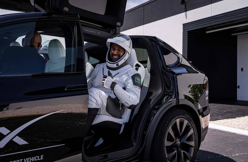 Saudi astronaut Ali Al Qarni in a Tesla vehicle during a launch dress rehearsal on May 20, 2023. AFP / Axiom Space