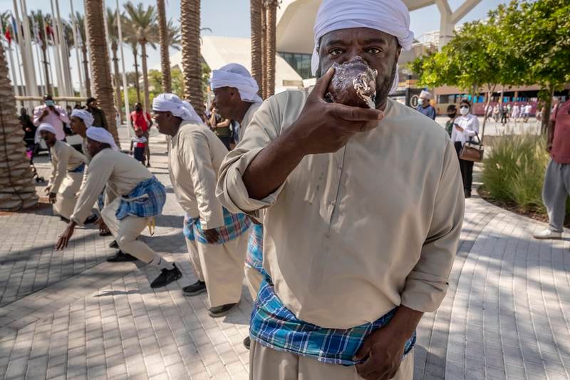 Emiratis and Omanis perform a traditional dance with traditional instruments native to the border areas that the two countries share.  Antonie Robertson / The National