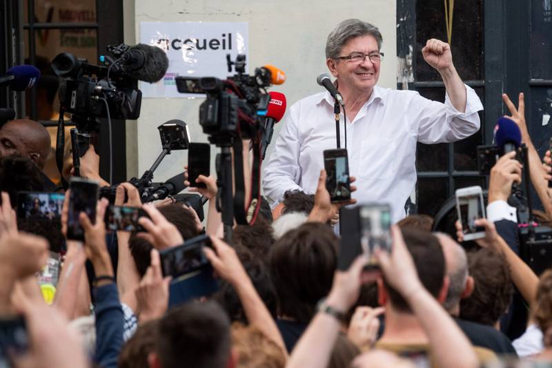 Mr Melenchon speaks to supporters following the first round of voting in parliamentary elections, in Paris. Bloomberg