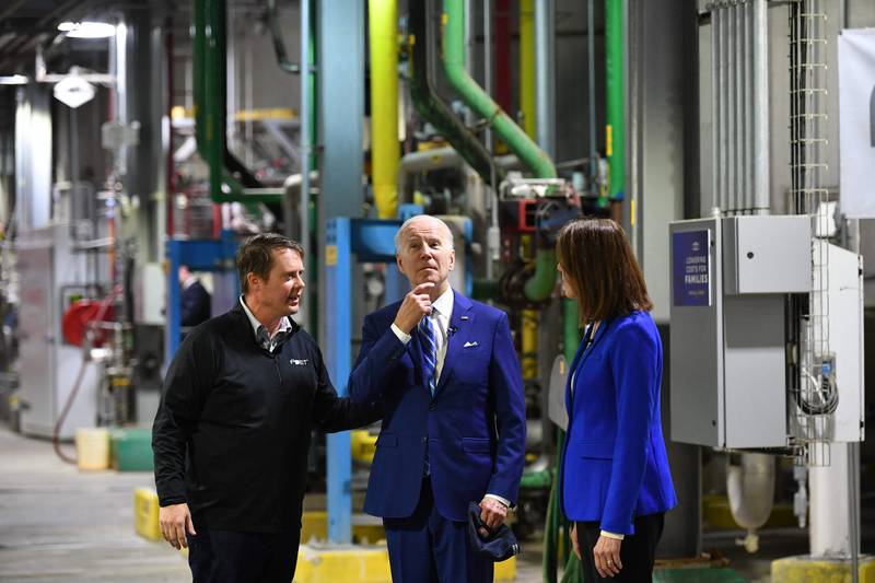 US President Joe Biden (C) speaks with Cindy Axne, US representative. and Jack Mitchell, Regional Vice President, POET Bioprocessing during a visit at the POET Bioprocessing plant in Menlo, Iowa. AFP