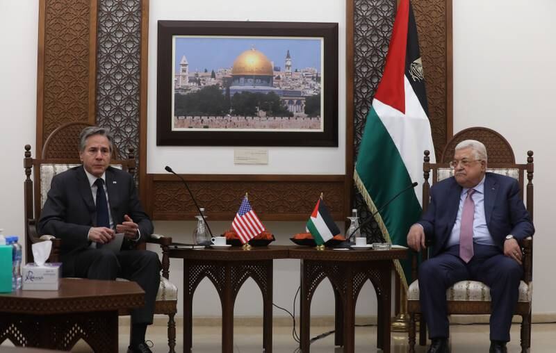 Palestinian President Mahmoud Abbas, right, and Mr Blinken meet in the West Bank city of Ramallah. EPA