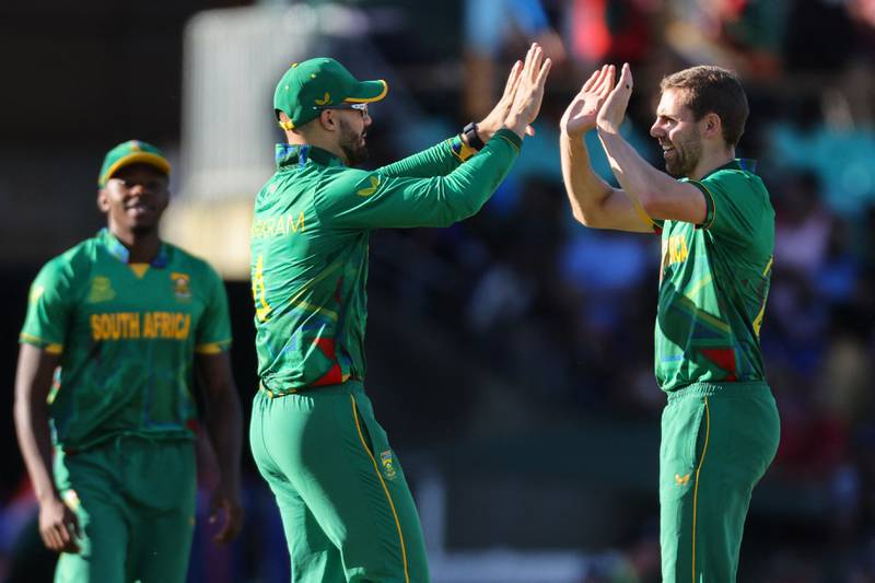 South Africa's Anrich Nortje celebrates a wicket with Aiden Markram. AFP