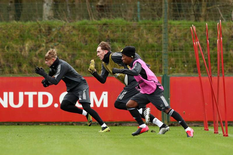 Brandon Williams, James Garner and Angel Gomes of Manchester United participate in a training session. Getty Images