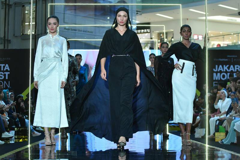 Indonesian models present creations by designer Araida of Russia during Jakarta Modest Fashion Week. AFP