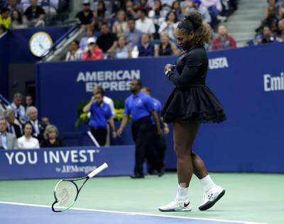 Serena Williams slams her racket on the court. AP