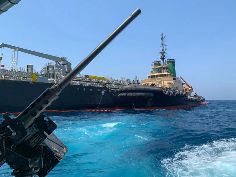 A picture taken during a guided tour by the US Navy (NAVCENT) shows the Japanese oil tanker Kokuka Courageous off the port of the Gulf emirate of Fujairah on June 19, 2019. The Japanese tanker attacked in the Gulf of Oman last week was damaged by a limpet mine resembling Iranian mines, the US military in the Middle East said today. Commander Sean Kido of the US Navy told reporters that the US military has recovered biometric information of the assailants on the Japanese ship including "hand and finger prints." Two oil tankers were damaged in twin attacks close to the Iranian coast on June 13, just outside the strategic Strait of Hormuz.
 / AFP / Mumen KHATIB
