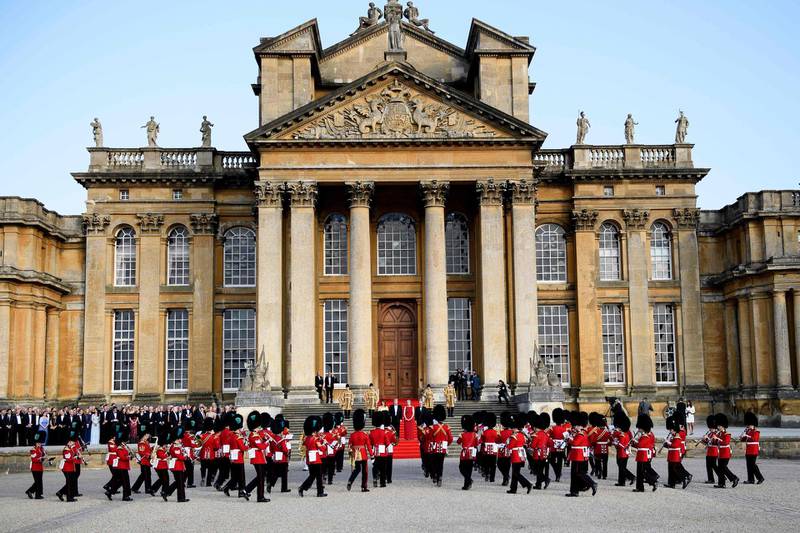 The bands of the Scots, Irish and Welsh Guards perform a ceremonial welcome in the Great Court of Blenheim Palace. AFP