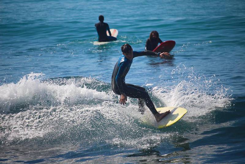 Ali Elamine, a pioneer of Lebanon’s nascent surf industry, saw the young Ali try to surf on a piece of discarded styrofoam board two years ago. Mr Elamine stopped Ali from entering the choppy waters without proper gear and equipment, and has since taught the Syrian teen how to surf. Josh Wood for The National