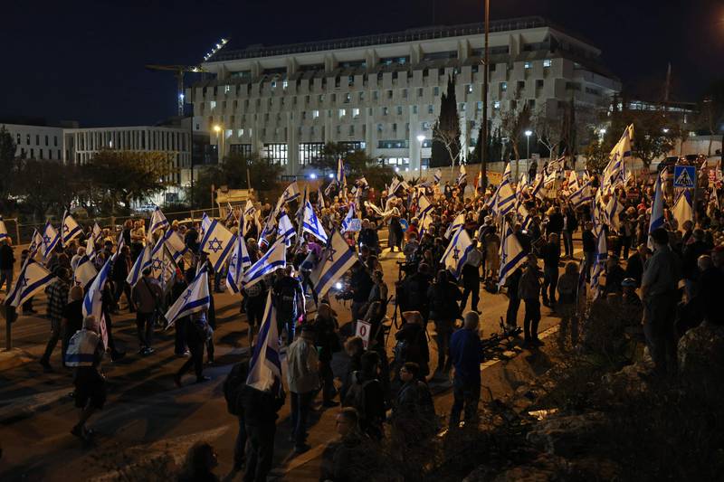 People gather outside the Knesset on Thursday to protest against the Israeli government's controversial justice reform bill. AFP