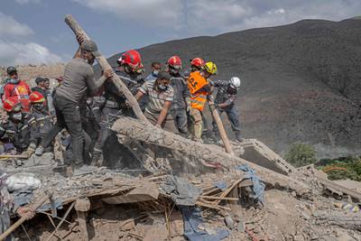 Rescue workers and civilians search among the rubble of destroyed houses in the Moroccan village of Imi N'Tala, near Amizmiz. AFP