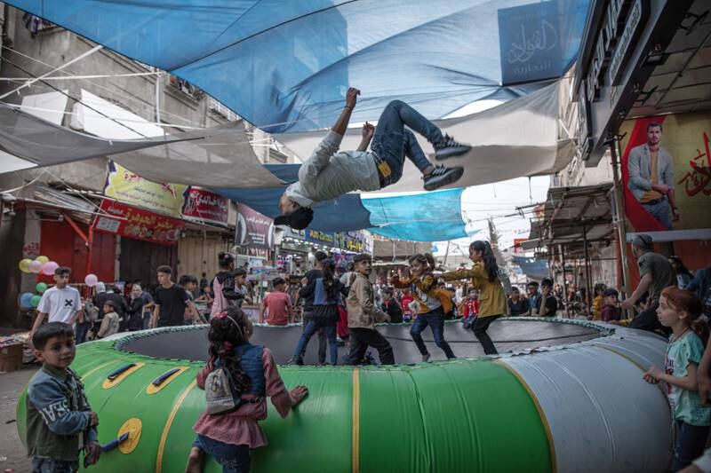 Palestinians enjoy their time on the first day of Eid Al Fitr in Jabalia refugee camp, in the northern Gaza Strip. Getty Images