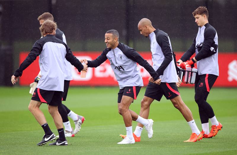Liverpool's Thiago Alcantara with teammates during training. Reuters