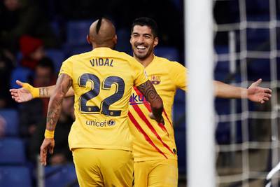 Luis Suarez celebrates with fellow Barcelona goalscorer Arturo Vidal. EPA