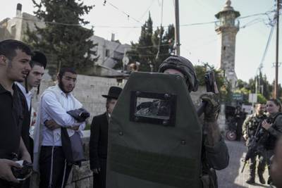 Israeli security forces search for suspects after a shooting in Sheikh Jarrah, East Jerusalem on Tuesday. AP