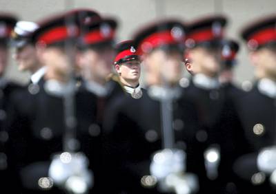 SANDHURST, UNITED KINGDOM - JUNE 21:  HRH Prince Harry(centre) takes part in the Trooping Of New Colours alongside his fellow officer cadets at the Royal Military Academy, Sandhurst on June 21, 2005 in Berkshire, England. The Queen was due to present the new colours military awards for the first time since 1991, but has cancelled the engagement with her Grandson due to a cold.  (Photo by MJ Kim/Getty Images)