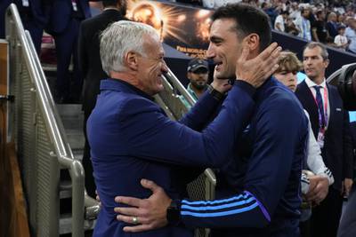 France manager Didier Deschamps, left, with his Argentina counterpart Lionel Scaloni before the game. AP