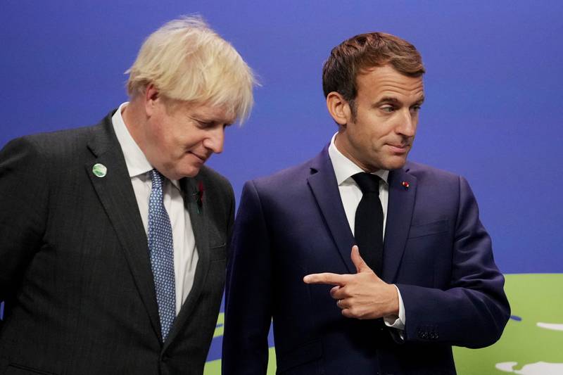 French President Emmanuel Macron and British Prime Minister Boris Johnson. AFP