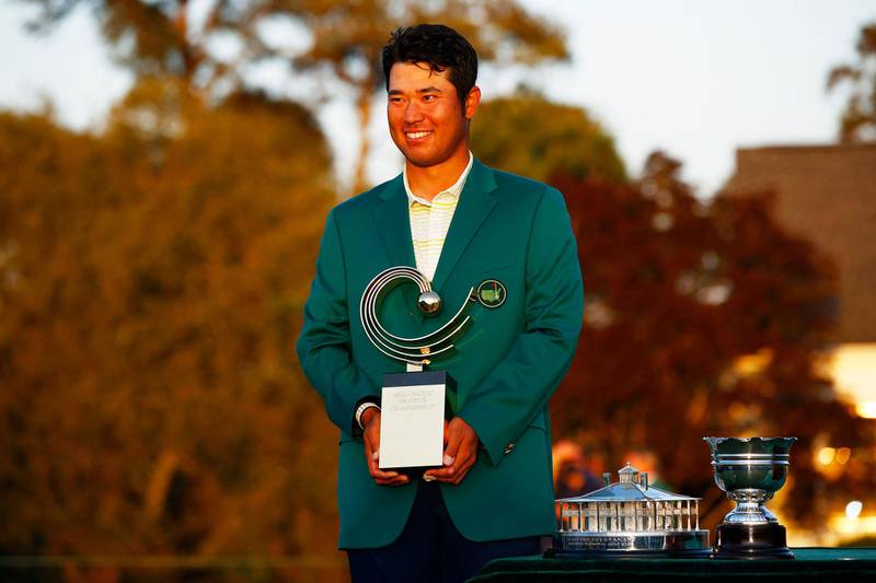 Hideki Matsuyama of Japan poses with the Asia Pacific Amateur Championship trophy during the Green Jacket Ceremony after winning the Masters at Augusta National Golf Club. AFP