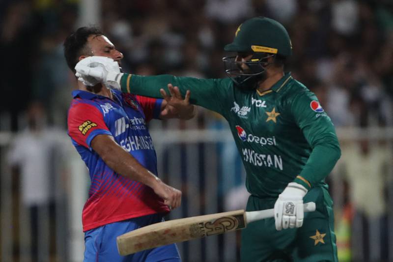 Pakistan's Asif Ali, right, and Afghanistan's Fareed Ahmad clashed at Sharjah Cricket Stadium on Wednesday. AFP
