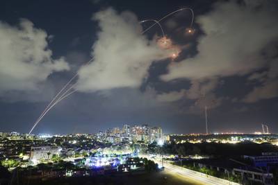 Israel's Iron Dome air defence system fires a missile above Ashkelon to intercept a rocket fired from Gaza. AP