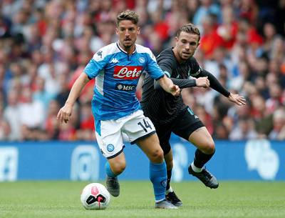 Napoli's Dries Mertens in action with Liverpool's Jordan Henderson. Reuters