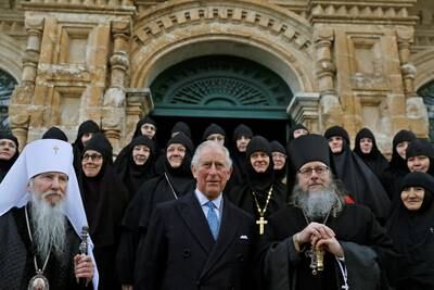 Prince Charles with Roman Krassovsky, right, Archimandrite of the Russian Orthodox Church Outside Russia and chief of its Russian Ecclesiastical Mission in Jerusalem, during a visit in Russian Orthodox Church of Mary Magdalene in 2020. Reuters