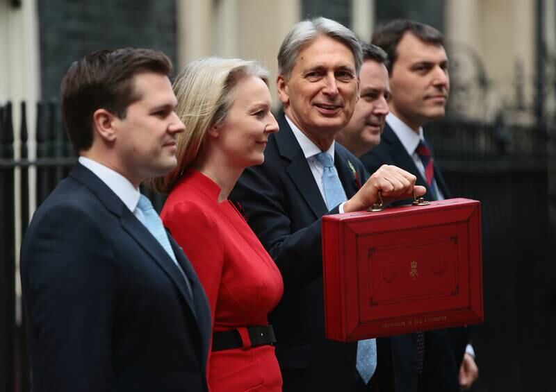 Liz Truss with the then chancellor of the exchequer, Philip Hammond, as he presents the budget in 2018. Getty Images