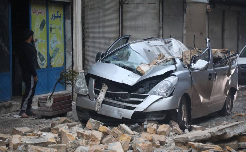 A car is smashed up by fallen debris in Azaz. Reuters