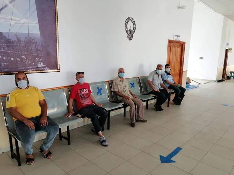 Algerians wait for their turn at a Covid-19 vaccination centre in central Algiers on January 19, 2022. The Algerian government has been urging its citizens to get inoculated against the coronavirus as case numbers rise. Photo: Jafer Saada.