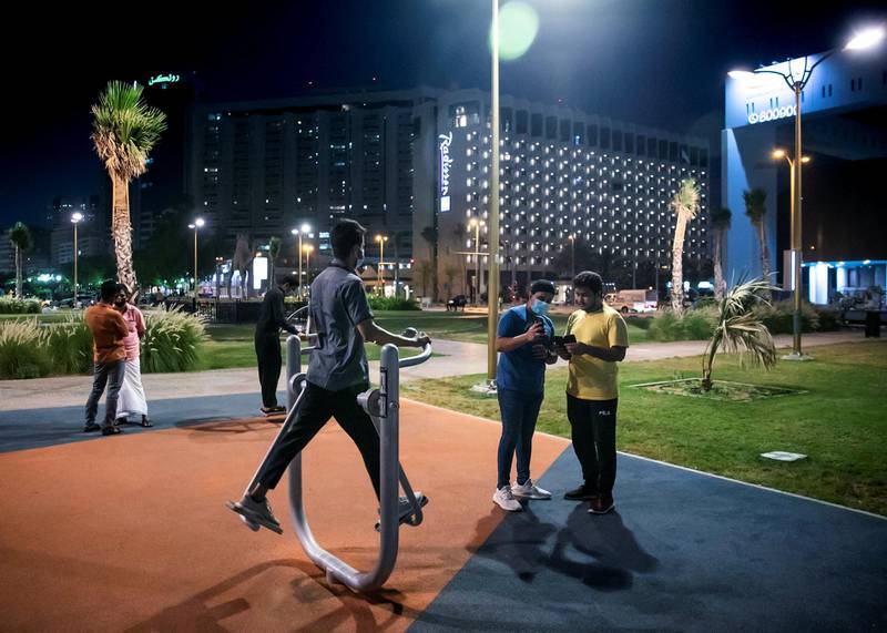 DUBAI, UNITED ARAB EMIRATES. 2 JUNE 2020. Men exercising in a park by Dubai Creek in Baniyas, Deira.(Photo: Reem Mohammed/The National)Reporter:Section: