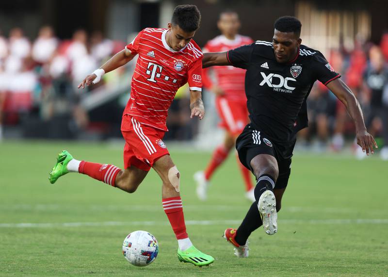 Lucas Copado of Bayern Munich battles for possession with Donovan Pines of DC United. AFP
