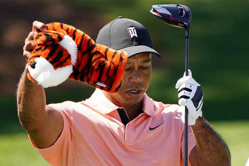 Tiger Woods takes out his driver during a practice session at Augusta National Golf Club. AP