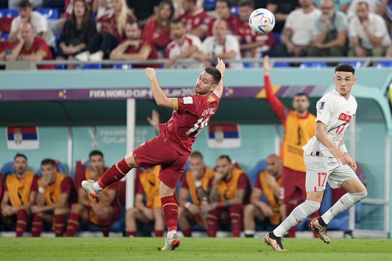 Serbia's Andrija Zivkovic, left, and Switzerland's Ruben Vargas vie for the ball during the World Cup group G soccer match between Serbia and Switzerland, at the Stadium 974 in Doha, Qatar. AP Photo