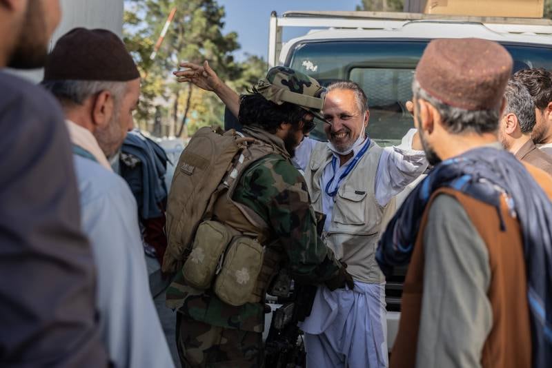 Taliban fighters man a checkpoint at the airport. Stefanie Glinski for The National
