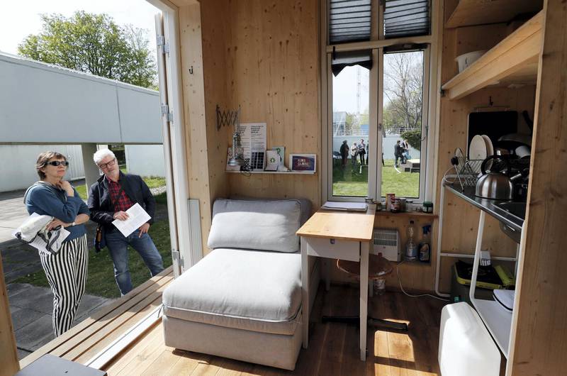 Mandatory Credit: Photo by Felipe Trueba/EPA/Shutterstock (8594904a)People look at the interior of a home unit, a small mobile living space, part of a project of the Tiny House University at the Bauhaus Archive Museum of Design in Berlin, Germany, 10 April 2017. The Bauhaus Campus is an artistic experiment composed of 'Tiny Houses', mobile architectural structures no larger than a parking space, approaching topics such as minimal living space, co-working or study programs for refugees.Tiny House project in Berlin, Germany - 10 Apr 2017