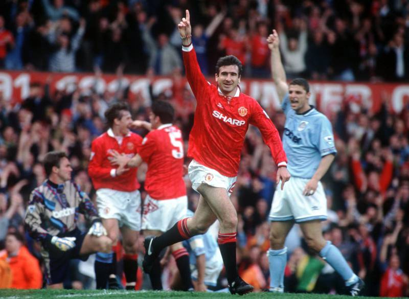 23 APR 1994:  A PICTURE SHOWING ERIC CANTONA OF MANCHESTER UNITED FOOTBALL CLUB AS HE RUNS OFF WITH HIS ARM RAISED IN CELEBRATION AFTER SCORING THE FIRST GOAL IN HIS FIRST GAME AFTER HIS SUSPENSION AGAINST MANCESTER CITY IN THEIR PREMIER LEAGUE MATCH Mandatory Credit: Anton Want/ALLSPORT/Getty Images