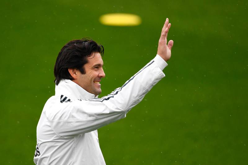 Temporary Real Madrid first-team manager Santiago Solari waves during a training session at the Ciudad Real Madrid training facilities as he prepares his team to take on Melilla in the Copa del Reyon Wednesday. AFP