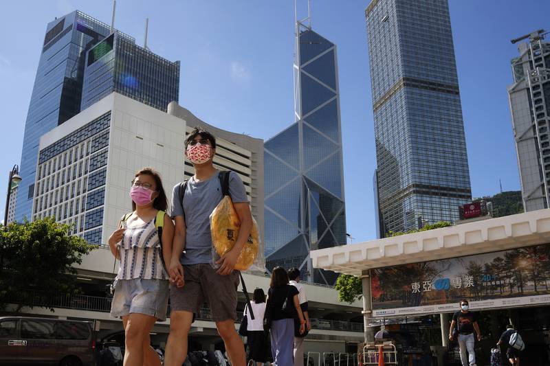 Travellers arriving in Hong Kong from mainland China will no longer need to quarantine, although strict restrictions remain for international passengers. AP Photo / Kin Cheung