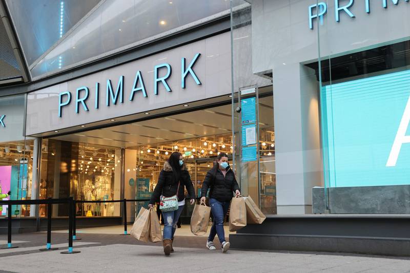 Customers with shopping bags visit Primark in Birmingham. Reuters