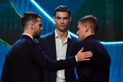 Juventus midfielder Miralem Pjanic, left, Cristiano Ronaldo (C) and Inter Milan midfielder Nicolo Barella pictured after being named in the Gran Gala del Calcio 2019 Best XI. AFP
