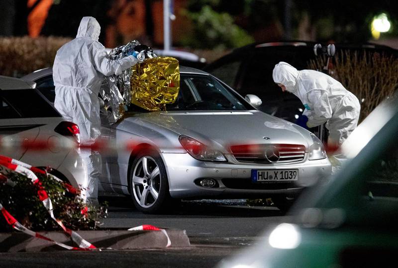 Police forensic officers investigate at the scene after a shooting in central Hanau, Germany. several people were killed in shootings in the German city of Hanau on Wednesday evening, authorities said.  AP Photo