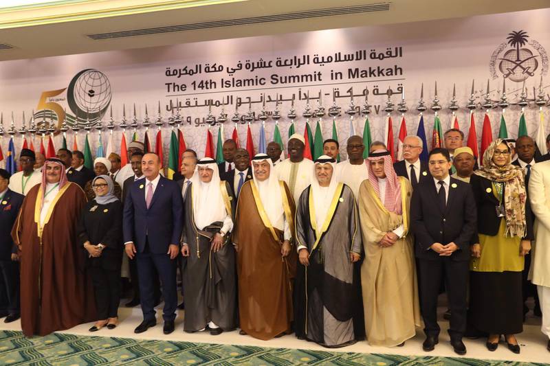 Islamic and Arab foreign ministers pose for a photo for the 14th Islamic Summit in Jeddah. AFP