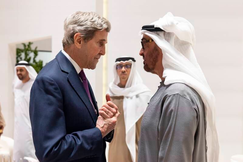President Sheikh Mohamed speaks to John Kerry, US presidential envoy for climate, at a reception before the opening ceremony. Photo: Presidential Court