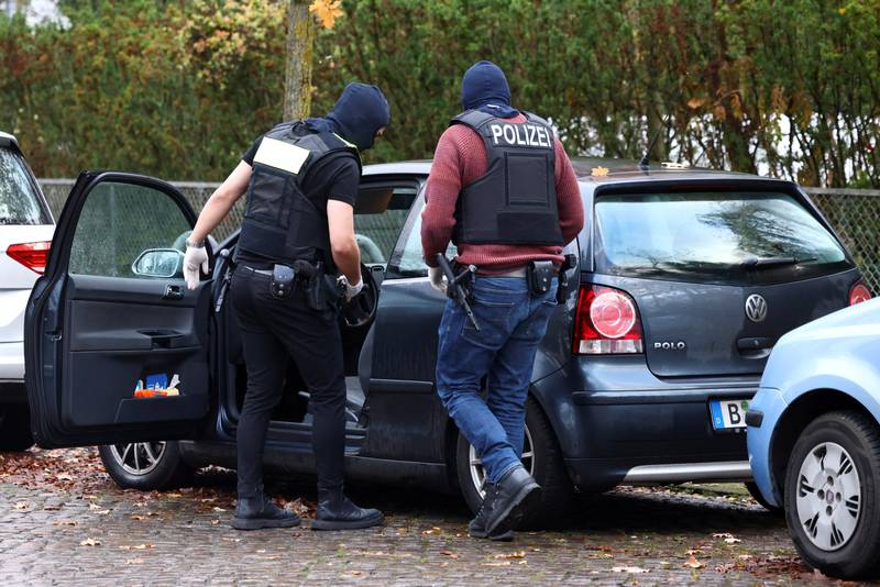 Police search a car in Berlin. Reuters